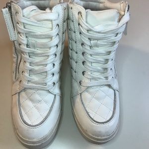 White wedge sneakers with metal stud detail
